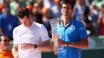 Novak Djokovic of Serbia holds the Butch Bucholz trophy