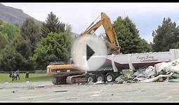 CAT 320D Excavator destroying a high school tennis court
